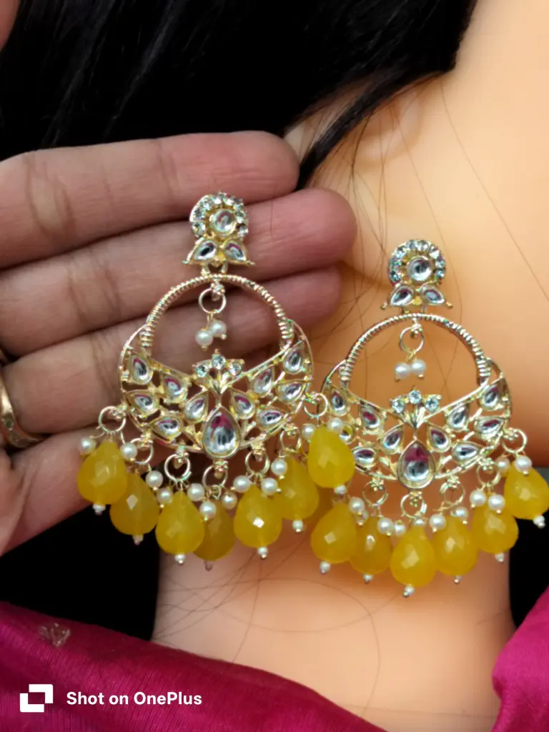 gold-plated kundan chandbali earrings with yellow crystal drops and pearls. 