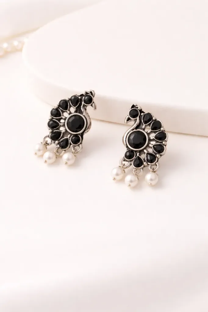 Oxidised black peacock earrings