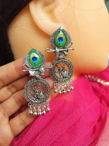 Oxidized Silver Krishna-Radha Earrings with Peacock Feather Design