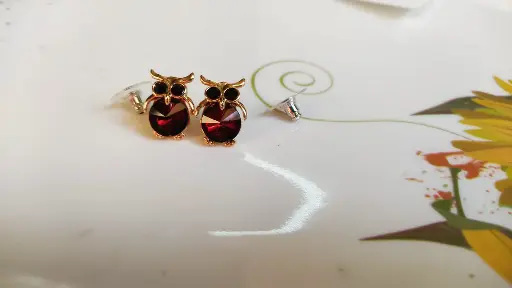**Owl-Inspired Ruby Red Stud Earrings**